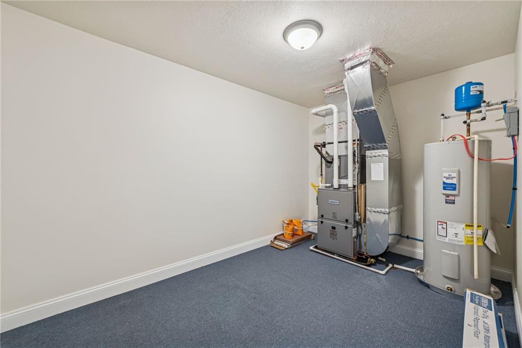 406 Kastner Street Ligonier, PA 15658 - Photo 34 of 35 an empty room with gym equipment and windows
