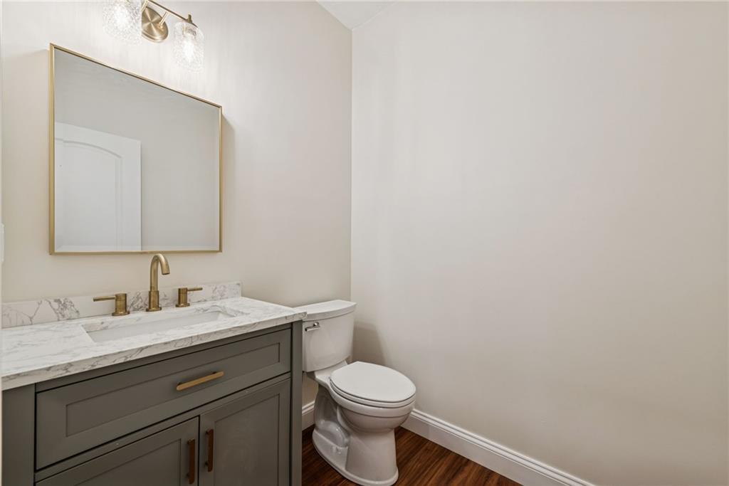 406 Kastner Street Ligonier, PA 15658 - Photo 10 of 35 a bathroom with a toilet sink vanity and mirror