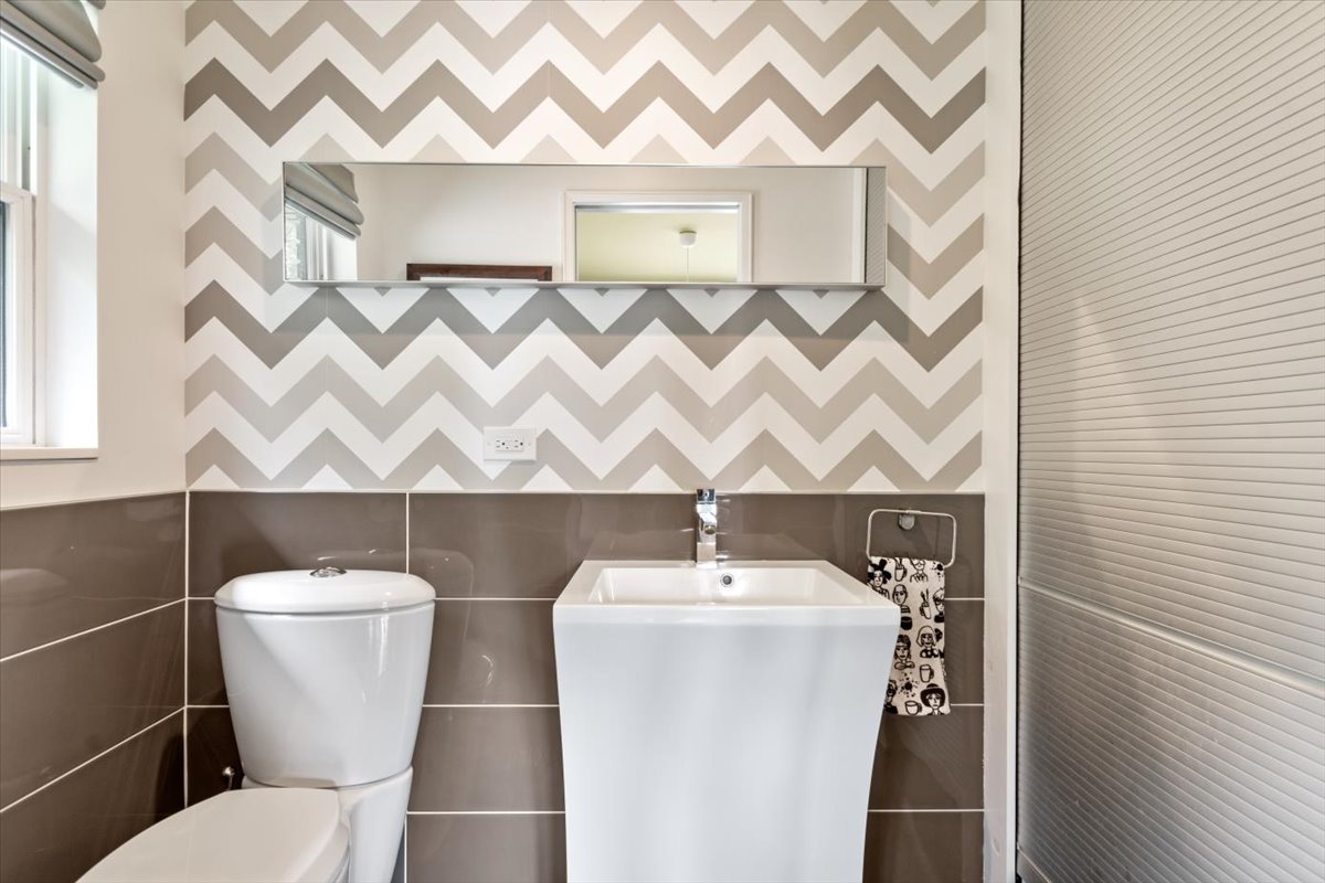 5N133 Kaelin Road Wayne, IL 60184 - Photo 22 of 35 a bathroom with a sink and a toilet