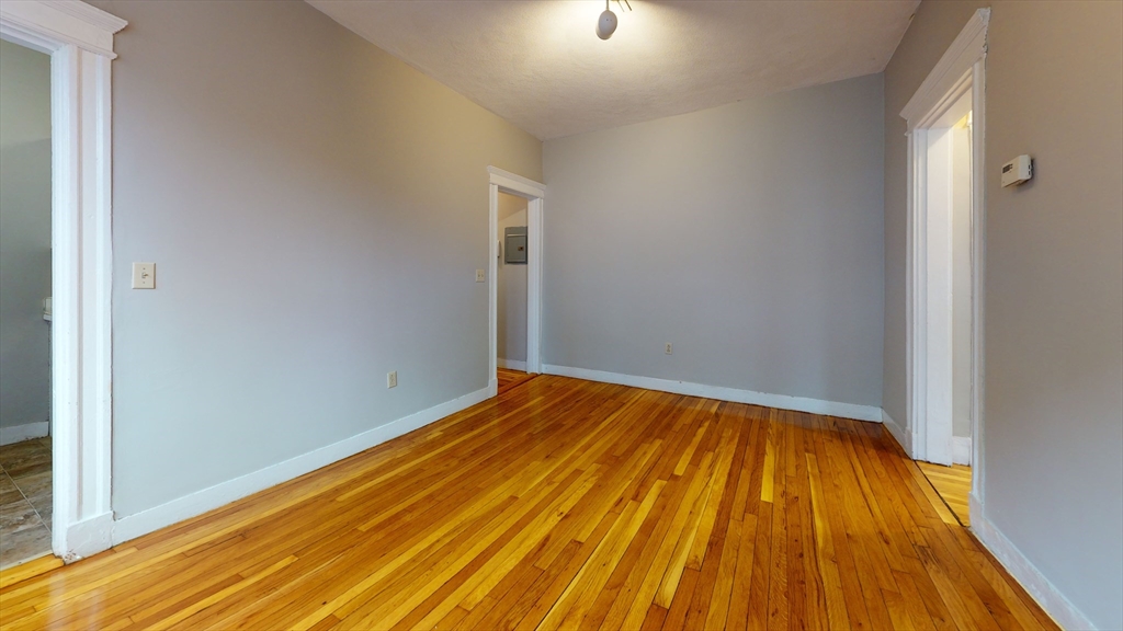 1625 Commonwealth Avenue, Unit 9 Boston, MA 02135 - Photo 3 of 8 a view of empty room with wooden floor