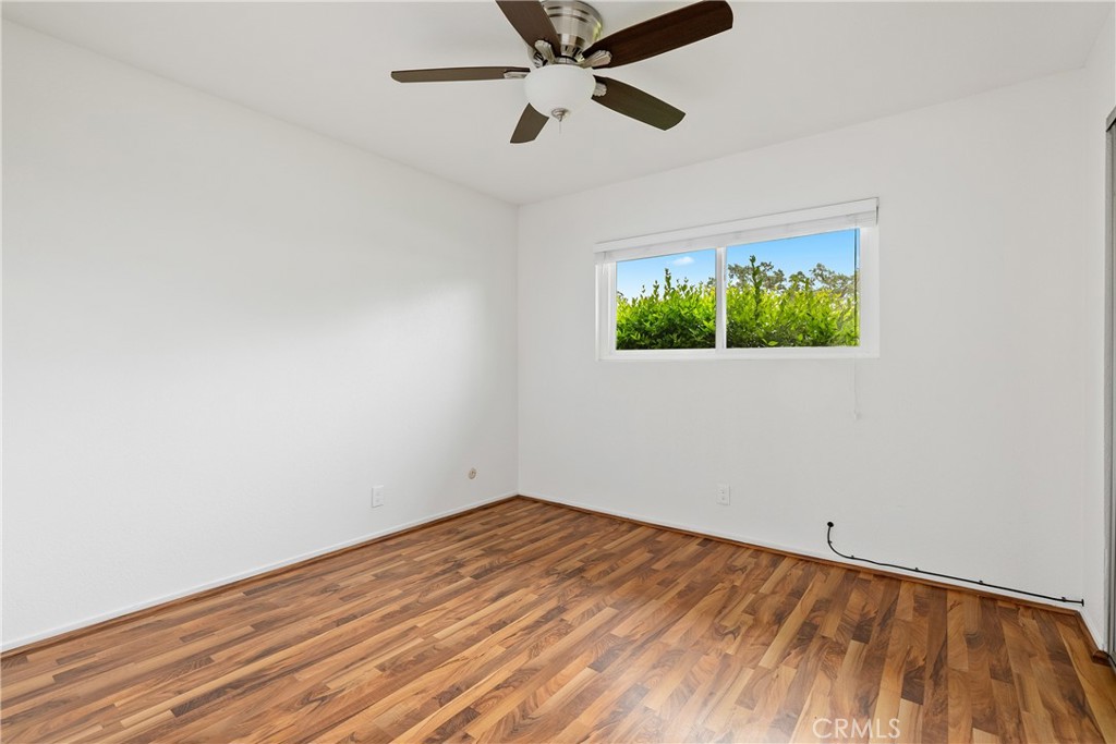 18 Flag Way Paso Robles, CA 93446 - Photo 15 of 22 an empty room with a window and a ceiling fan