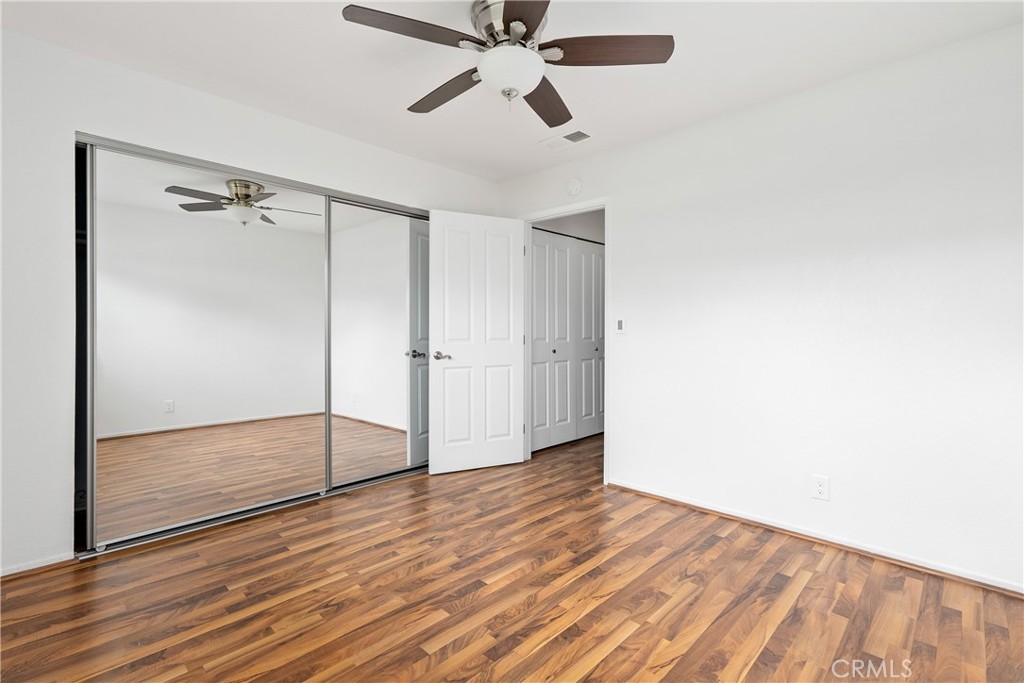 18 Flag Way Paso Robles, CA 93446 - Photo 16 of 22 a view of empty room with wooden floor and fan