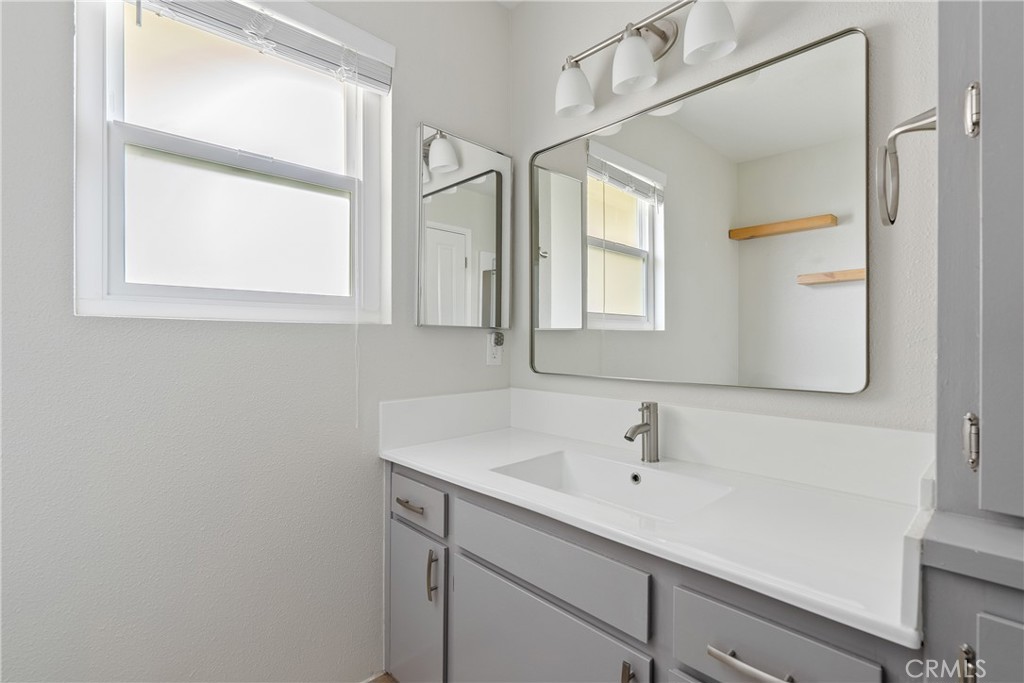 18 Flag Way Paso Robles, CA 93446 - Photo 17 of 22 a bathroom with a sink and a mirror