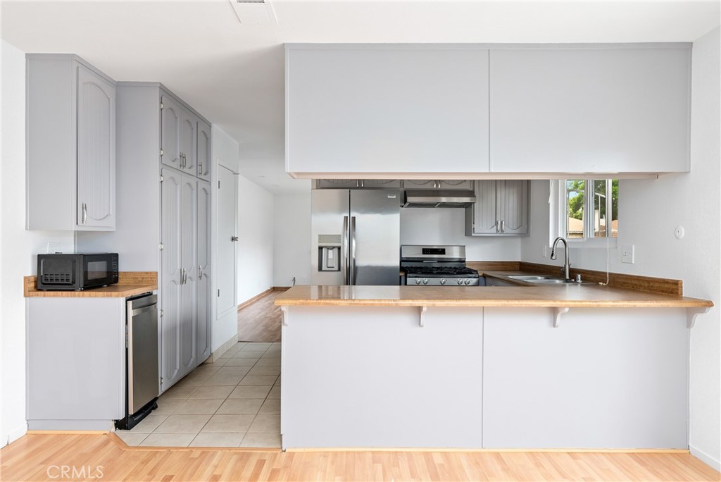 18 Flag Way Paso Robles, CA 93446 - Photo 8 of 22 a kitchen with stainless steel appliances granite countertop a sink and a stove