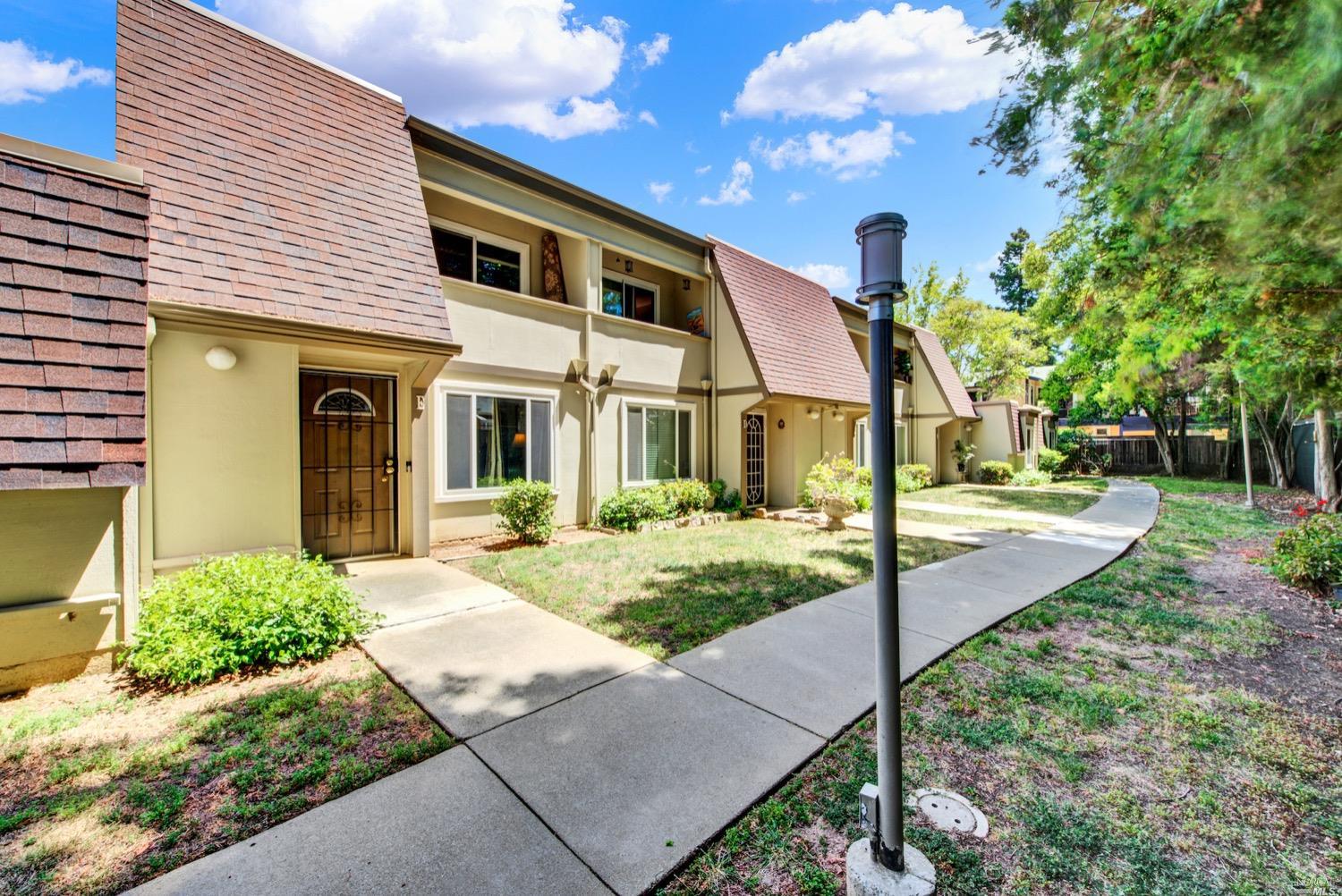 a front view of a house with garden