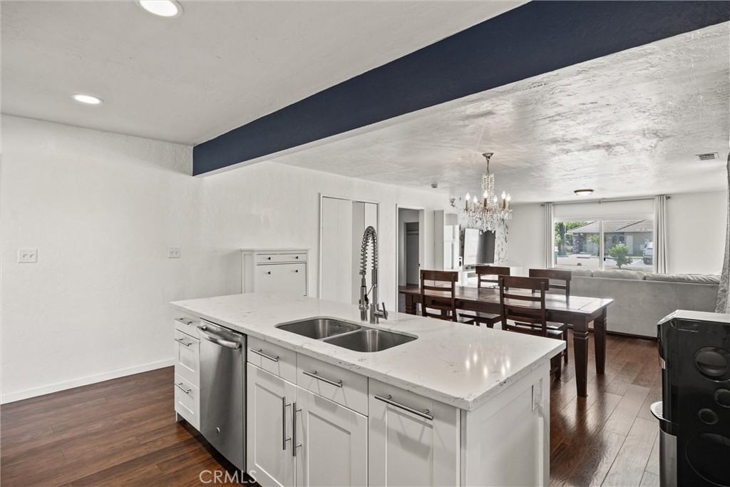 417 Jefferson Street Willows, CA 95988 - Photo 16 of 32 a kitchen that has a sink a stove and chairs