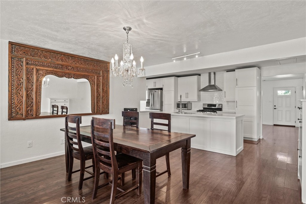 417 Jefferson Street Willows, CA 95988 - Photo 17 of 32 a view of a dining room with furniture and wooden floor