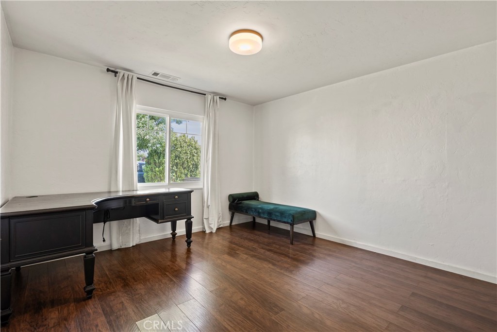 417 Jefferson Street Willows, CA 95988 - Photo 23 of 32 a living room with furniture and a wooden floor