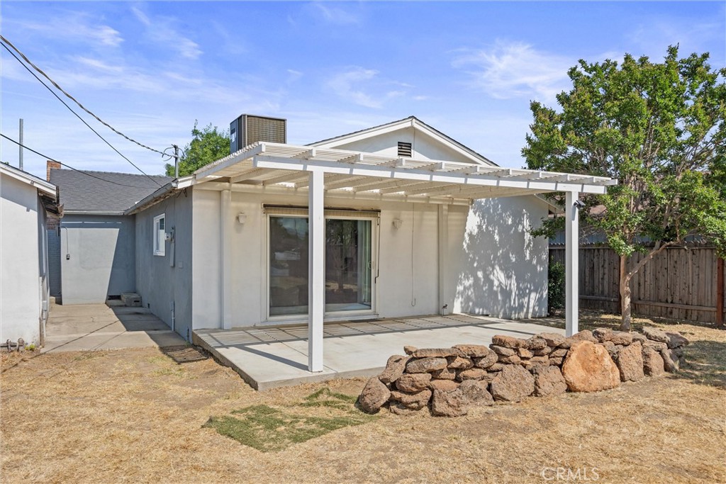 417 Jefferson Street Willows, CA 95988 - Photo 31 of 32 a view of a house with large windows and wooden fence