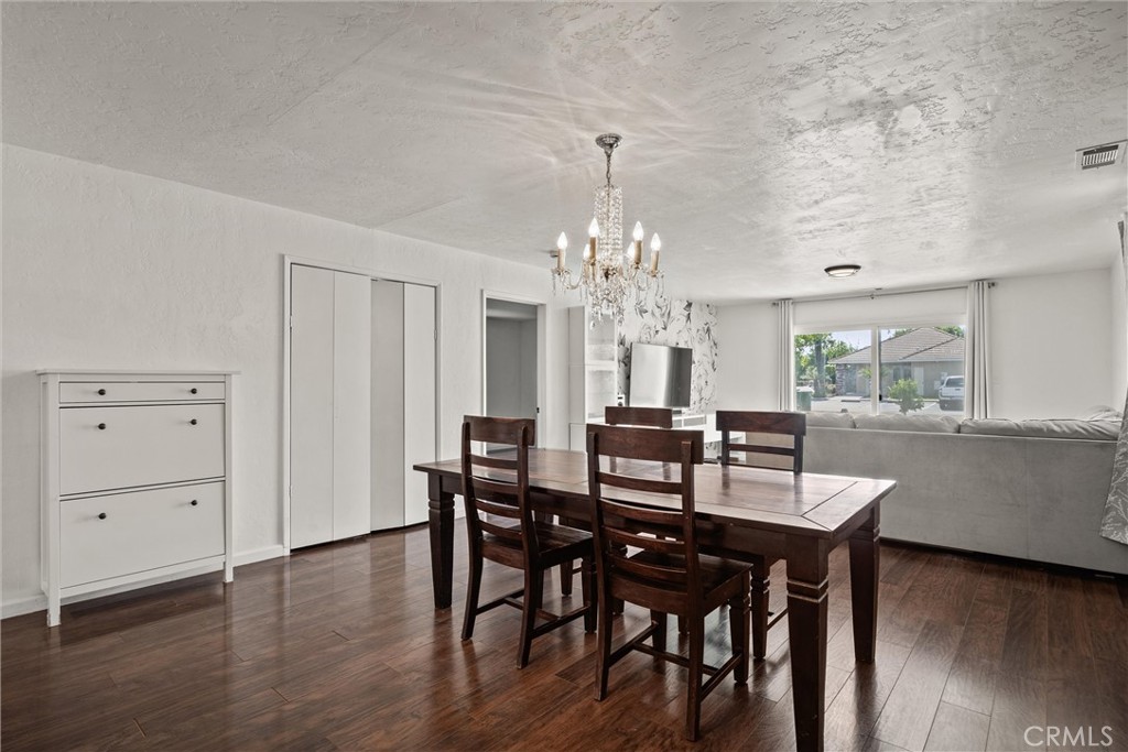 417 Jefferson Street Willows, CA 95988 - Photo 4 of 32 a view of a dining room with furniture and wooden floor