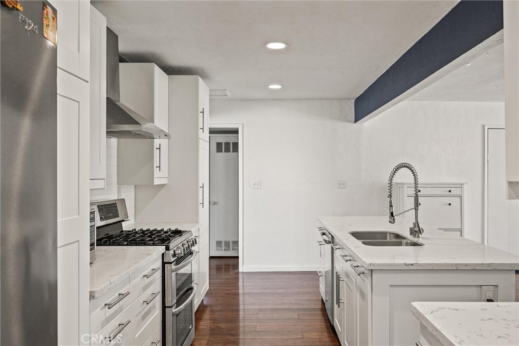 417 Jefferson Street Willows, CA 95988 - Photo 8 of 32 a kitchen with stainless steel appliances granite countertop a sink stove and refrigerator