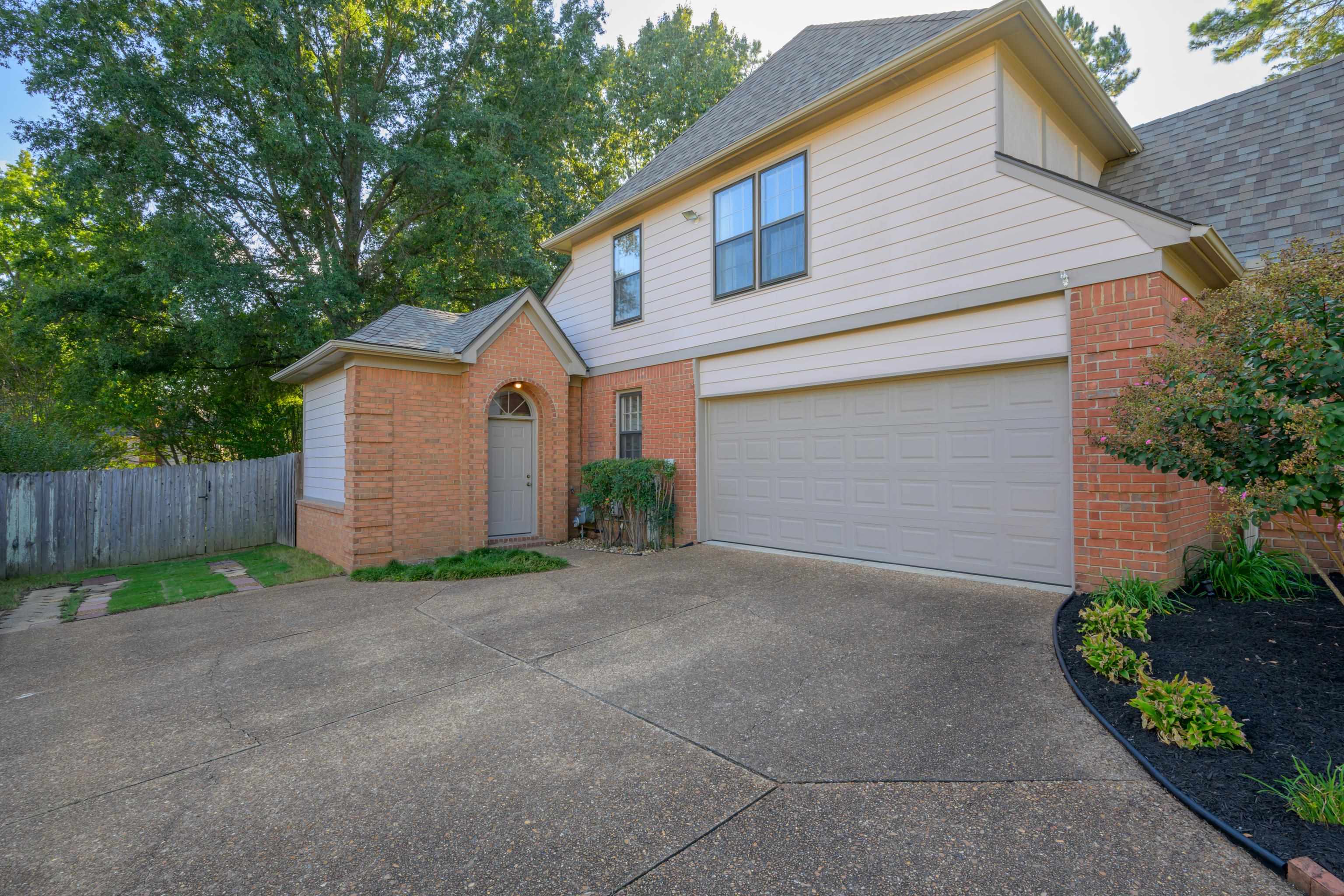 10265 Crooked Creek Road Collierville, TN 38017 - Photo 4 of 40 Exterior entrance to Flex Room -- perfect for home office, work shop, or exercise room. AND extra parking pad--makes backing out of the garage super easy!
