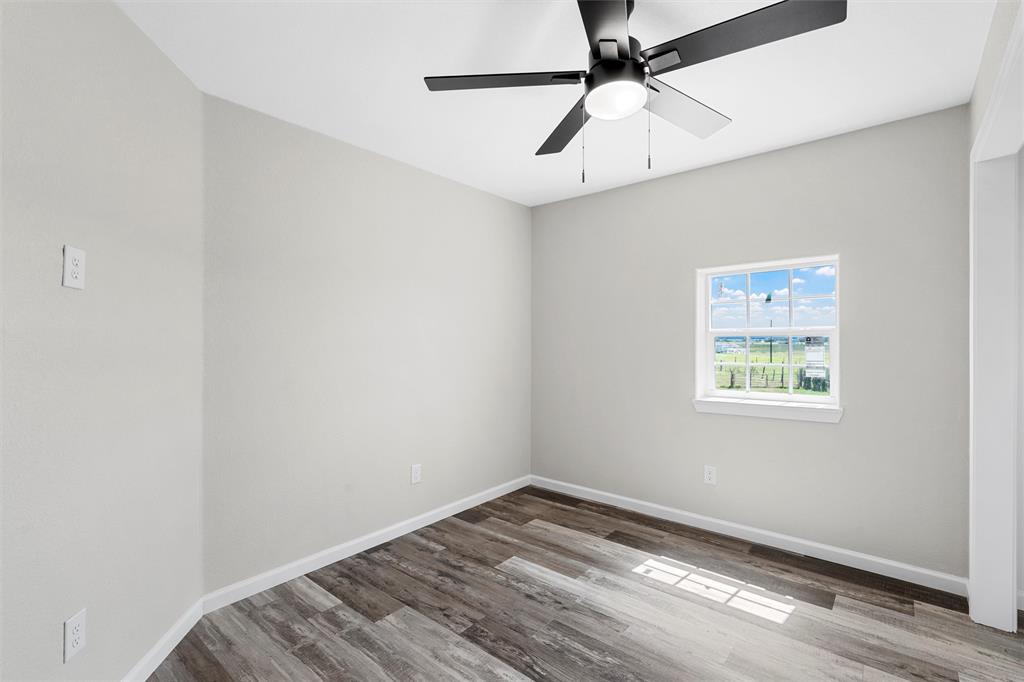 145 129a Marlin, TX 76661 - Photo 15 of 38 a view of empty room with wooden floor