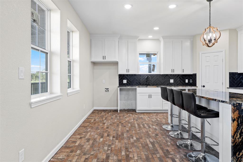 145 129a Marlin, TX 76661 - Photo 8 of 38 a kitchen with stainless steel appliances granite countertop a stove a sink and a refrigerator