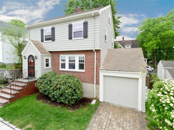 7 Sunnybank Road Boston, MA 02132 - Photo 1 of 18 a front view of a house with a garden and plants
