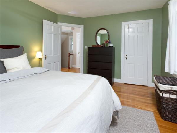 7 Sunnybank Road Boston, MA 02132 - Photo 12 of 18 a bedroom with a bed and wooden floor