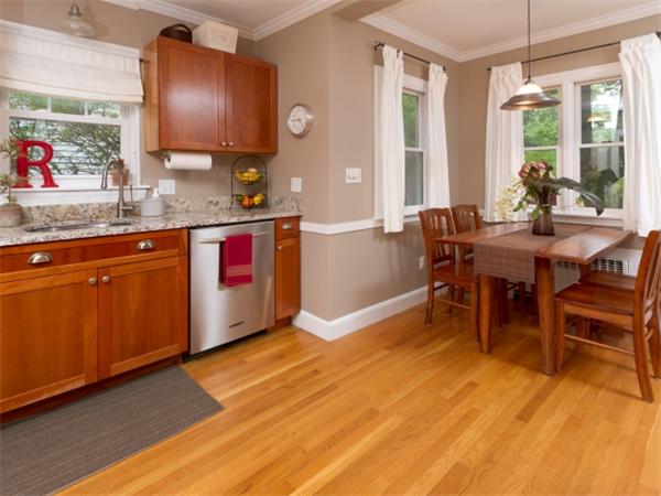 7 Sunnybank Road Boston, MA 02132 - Photo 5 of 18 a view of kitchen with granite countertop dining room and wooden floor
