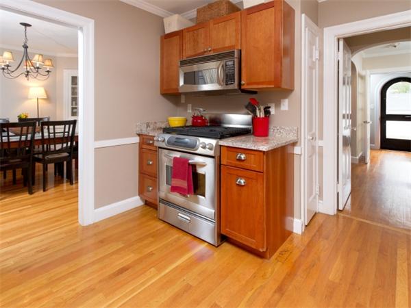 7 Sunnybank Road Boston, MA 02132 - Photo 7 of 18 a kitchen with stainless steel appliances granite countertop a stove a sink and a refrigerator