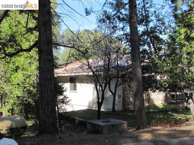 20280 Little Valley Road Groveland, CA 95321 - Photo 9 of 24 a view of a yard with plants and trees