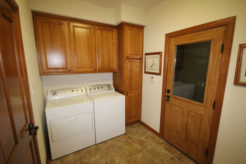 5255 Lookout Ridge Drive Marble Falls, TX 78654 - Photo 40 of 40 Cabinets beside door to garage