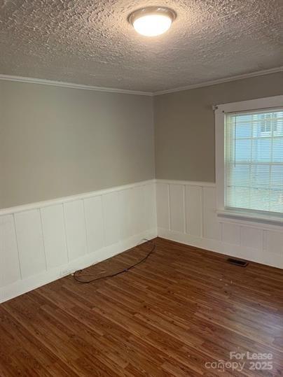 1036 Ridge Avenue Gastonia, NC 28052 - Photo 3 of 11 a view of an empty room with wooden floor and a window