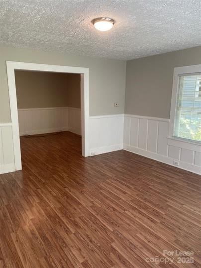 1036 Ridge Avenue Gastonia, NC 28052 - Photo 4 of 11 an empty room with wooden floor and windows