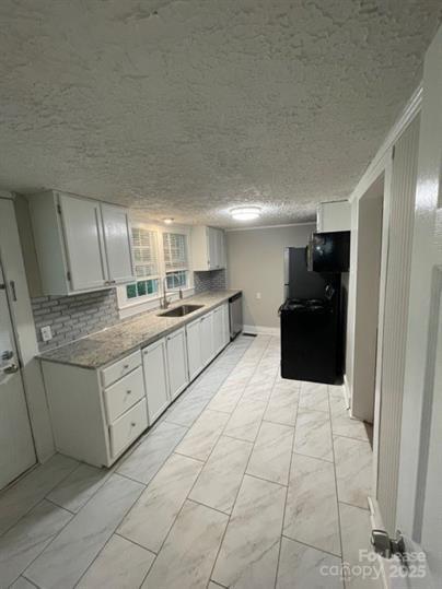 1036 Ridge Avenue Gastonia, NC 28052 - Photo 8 of 11 a kitchen with stainless steel appliances granite countertop a refrigerator and a stove top oven