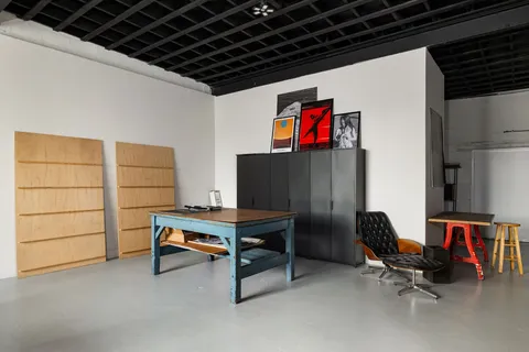 a view of a workspace with furniture
