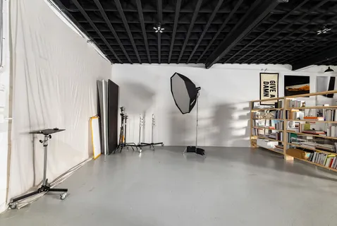 a view of a livingroom with gym equipment
