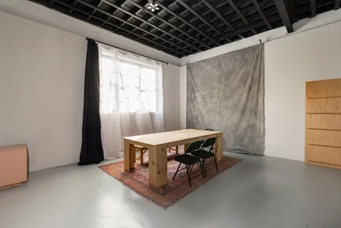 a room with a table and a window