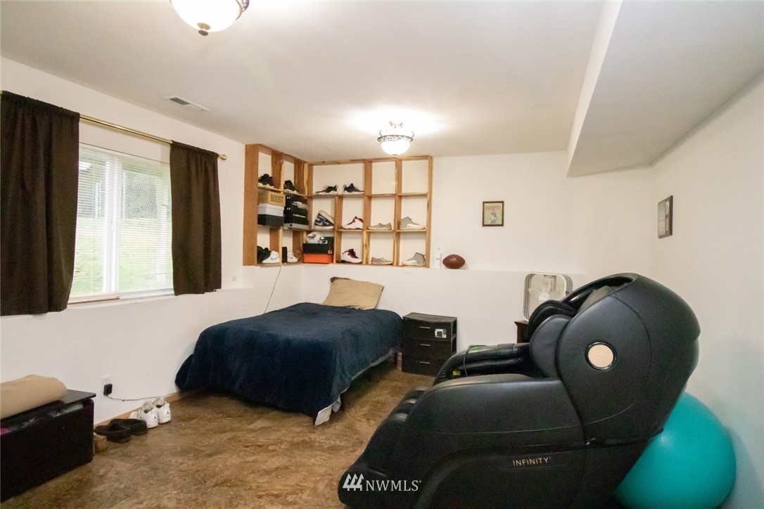 214 Fern Meadows Loop Southeast Port Orchard, WA 98366 - Photo 14 of 23 a bedroom with furniture and a window