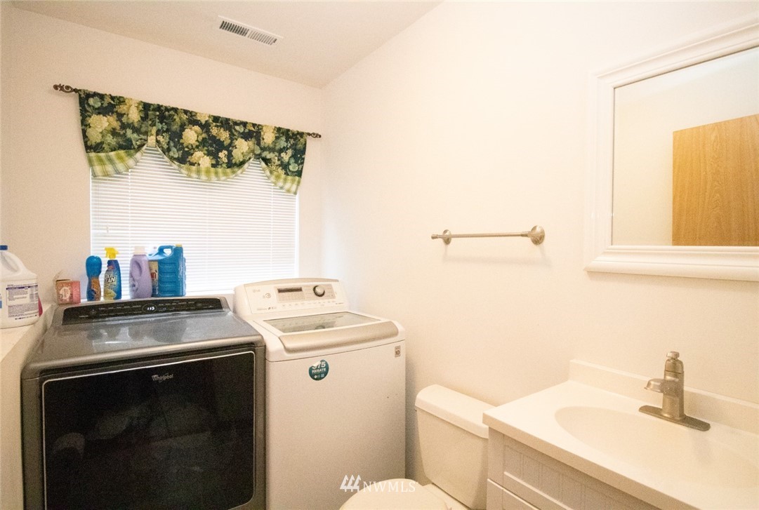 214 Fern Meadows Loop Southeast Port Orchard, WA 98366 - Photo 15 of 23 a utility room with dryer and washer