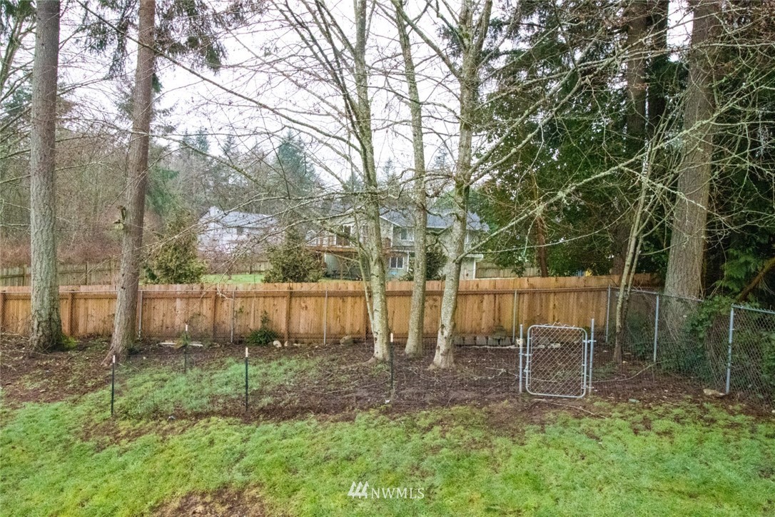 214 Fern Meadows Loop Southeast Port Orchard, WA 98366 - Photo 17 of 23 a view of a backyard with a fountain