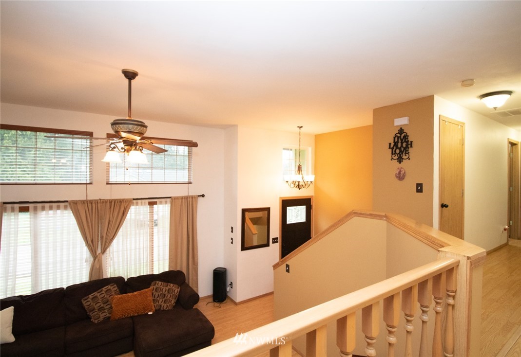 214 Fern Meadows Loop Southeast Port Orchard, WA 98366 - Photo 5 of 23 a living room with furniture and a window