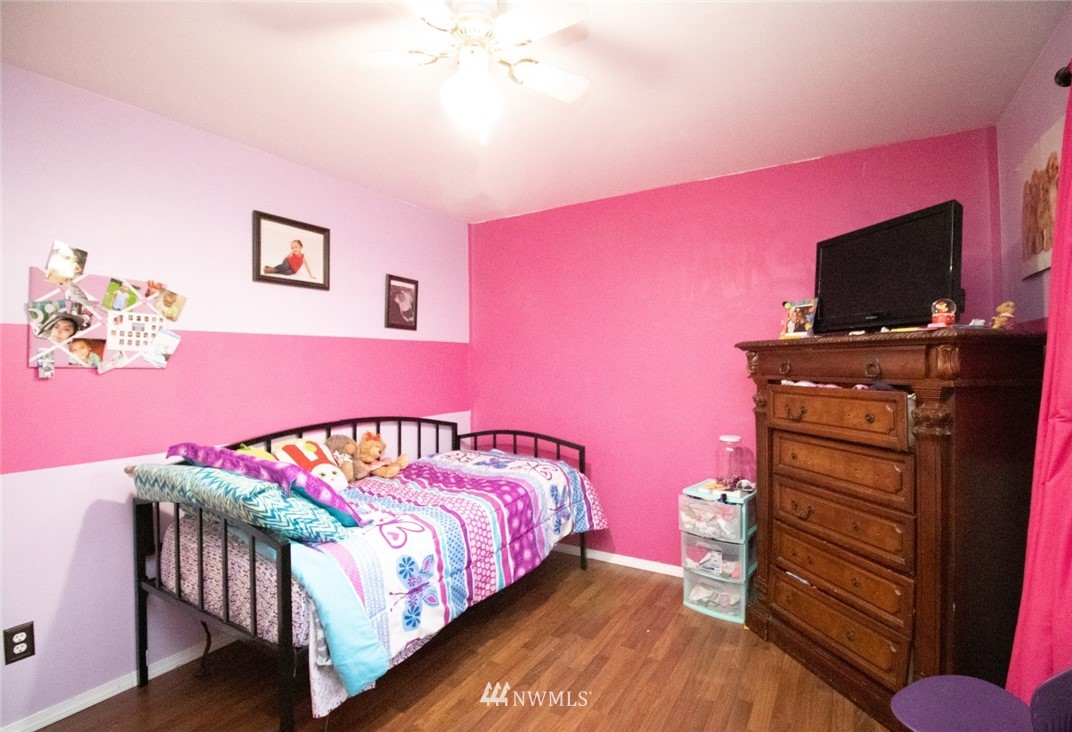 214 Fern Meadows Loop Southeast Port Orchard, WA 98366 - Photo 9 of 23 a bedroom with a bed and a flat screen tv