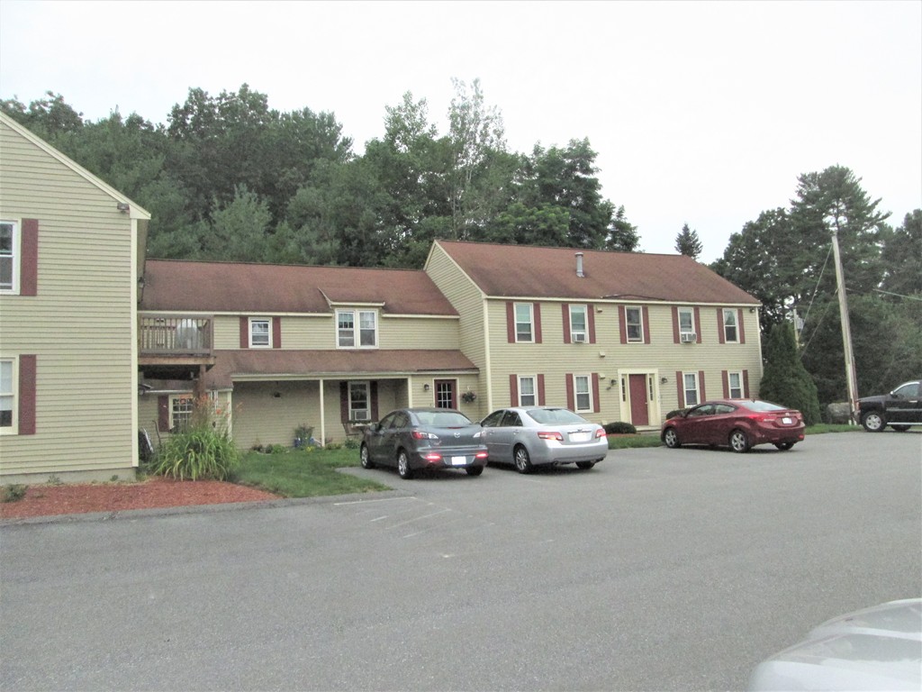a view of multiple houses with a street