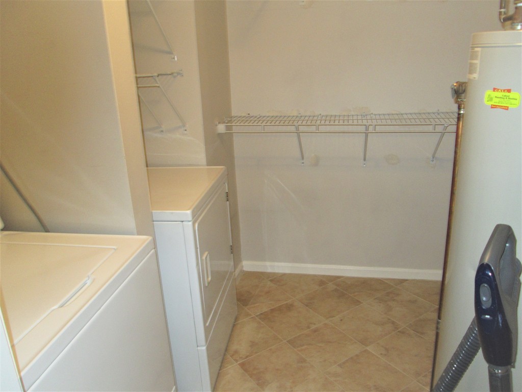 32 Lantern Lane, Unit 8 Dracut, MA 01826 - Photo 14 of 14 a utility room with dryer and washer