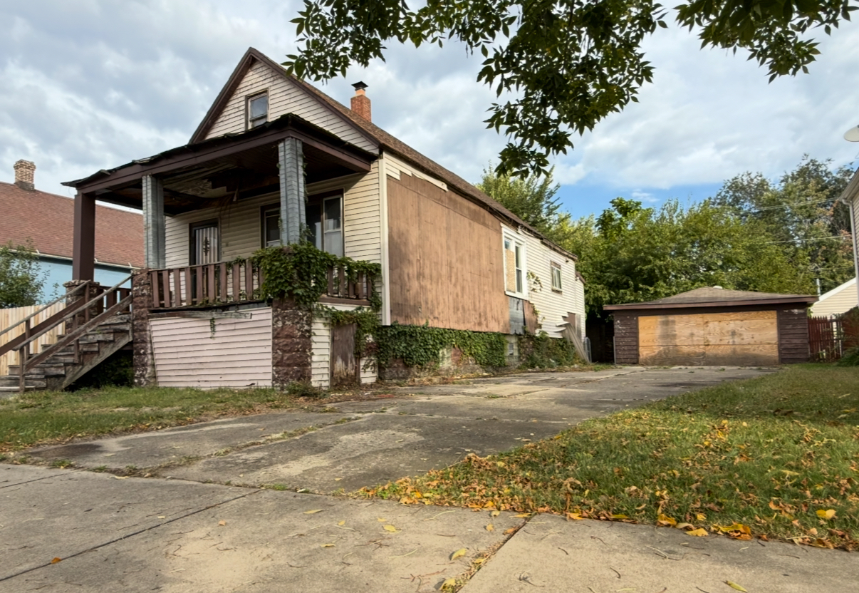 28 156th Street Calumet City, IL 60409 - Photo 24 of 24 a front view of a house with a yard and garage