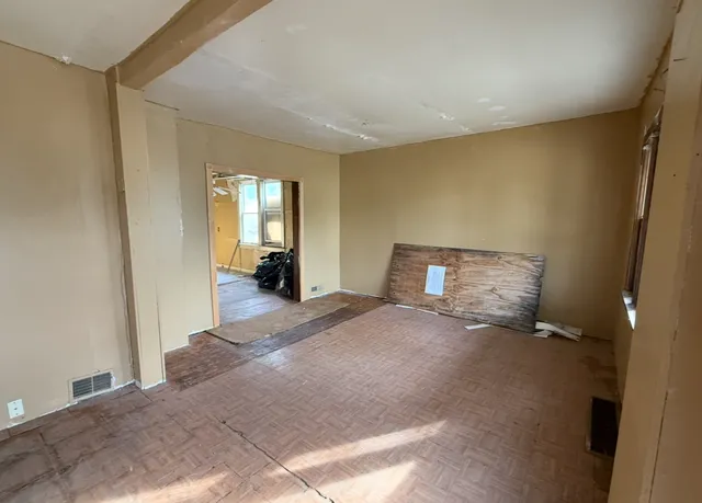 a bedroom with a bed and a mirror