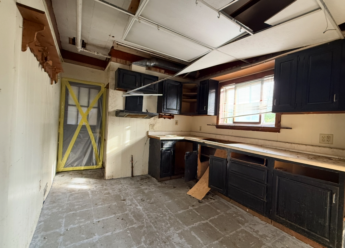 28 156th Street Calumet City, IL 60409 - Photo 5 of 24 a kitchen with a sink cabinets and window