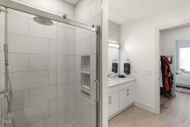 a bathroom with a double vanity sink a vanity and a mirror