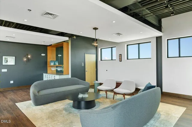 a living room with furniture and a rug