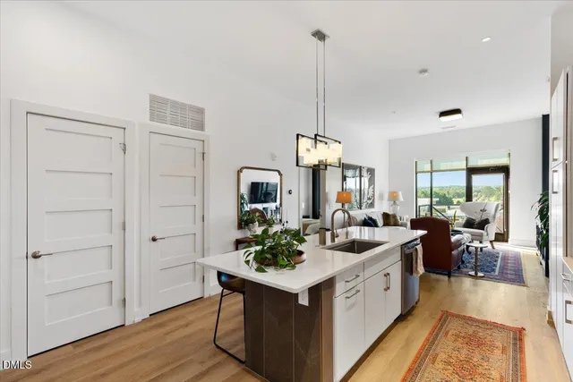 a very nice looking room with a large window and wooden floor