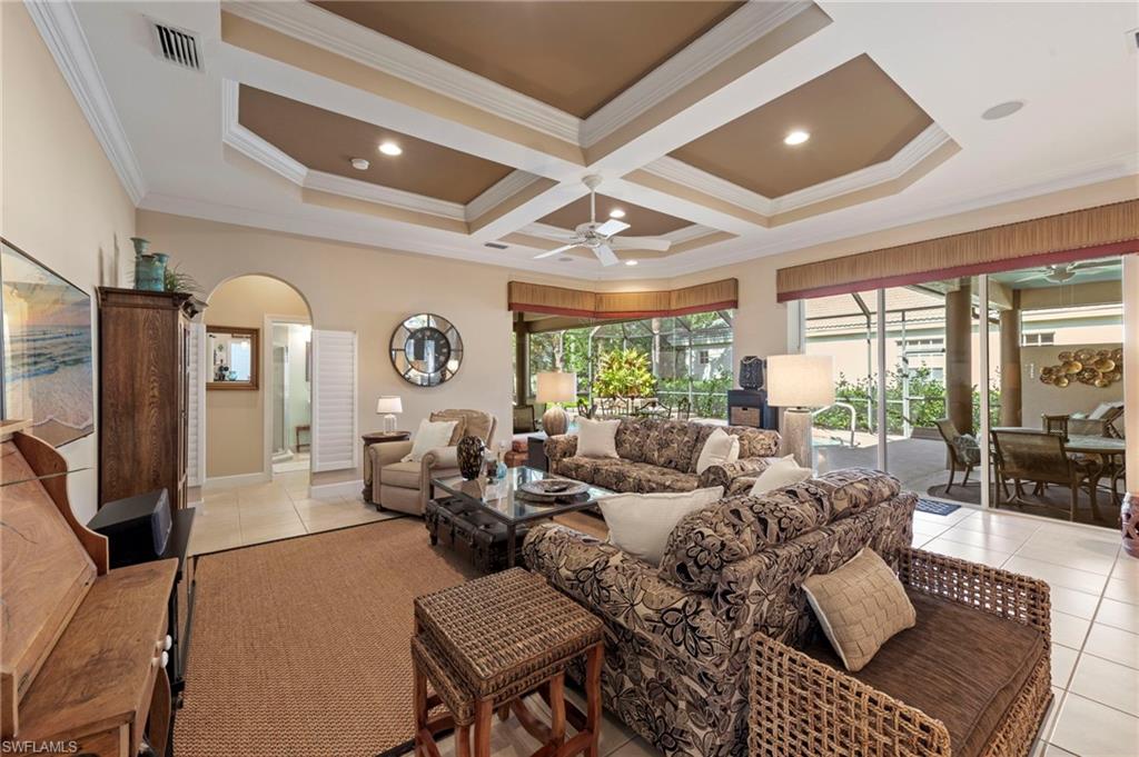 20042 Buttermere Court Estero, FL 33928 - Photo 20 of 47 a living room with furniture a large window and a rug