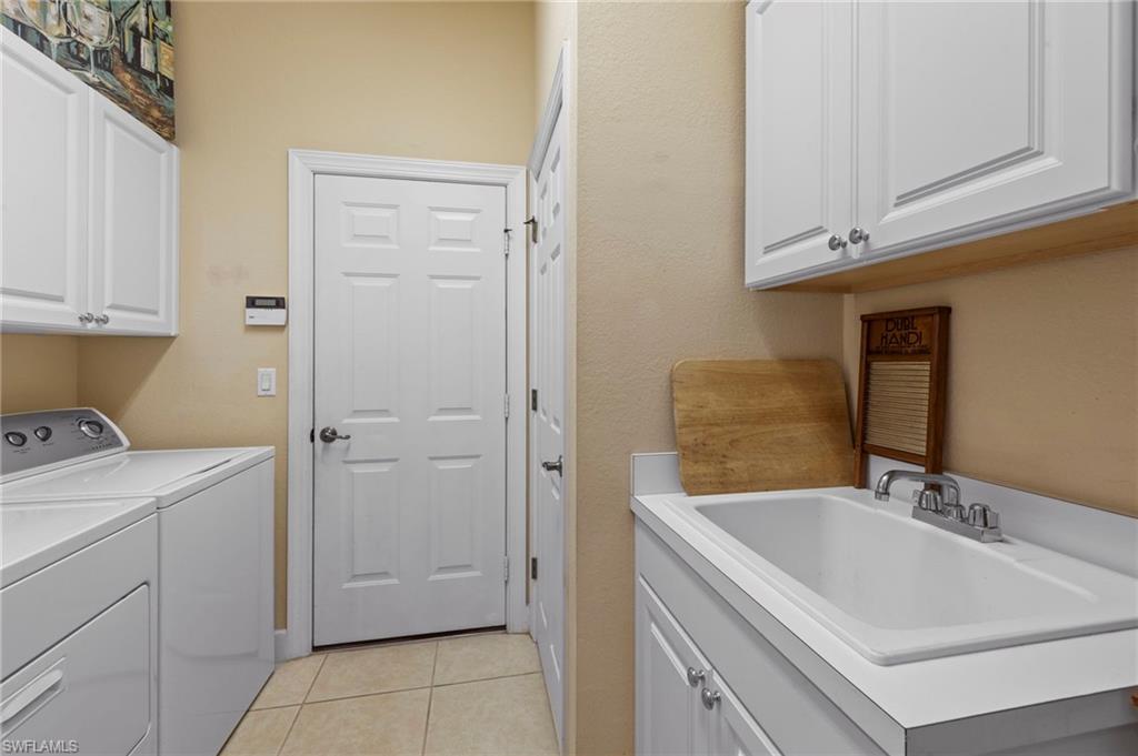 20042 Buttermere Court Estero, FL 33928 - Photo 22 of 47 a bathroom with a sink and a mirror