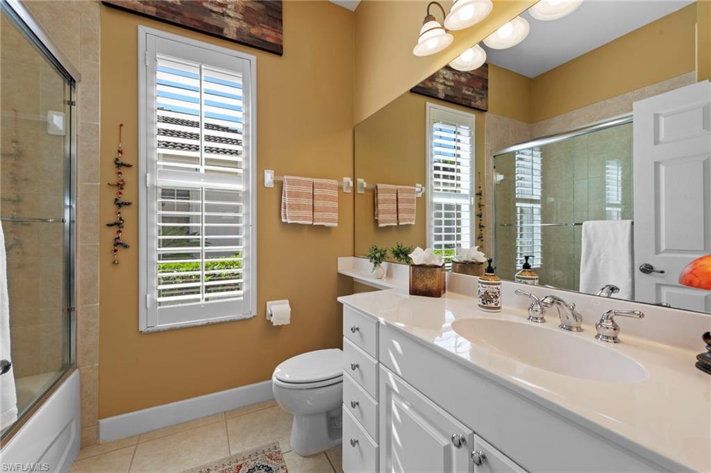 20042 Buttermere Court Estero, FL 33928 - Photo 23 of 47 a bathroom with a sink a toilet and a mirror