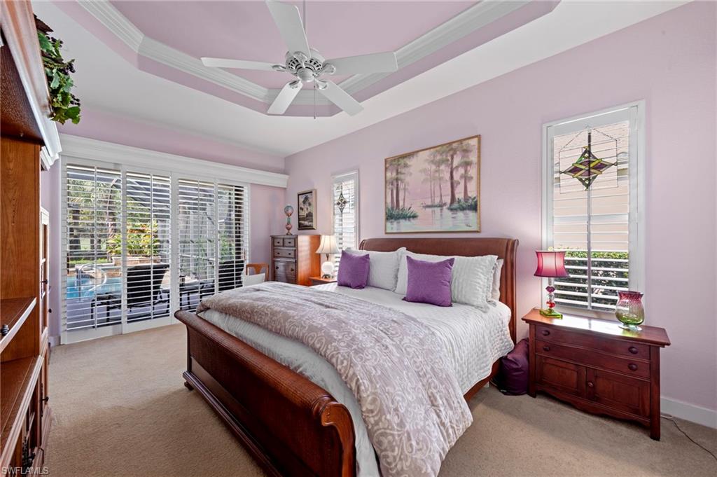 20042 Buttermere Court Estero, FL 33928 - Photo 27 of 47 a bed room with a bed and a chandelier