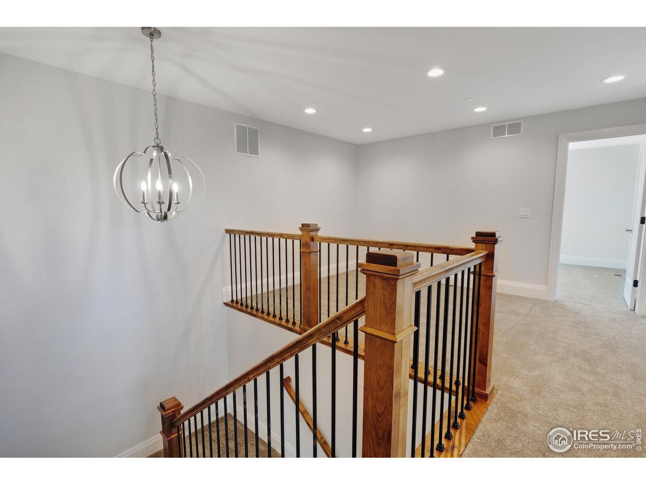 5700 2nd Road Greeley, CO 80634 - Photo 26 of 40 Stylish wrought-iron bannisters lead to the loft