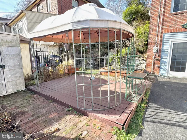 a view of a backyard with a patio
