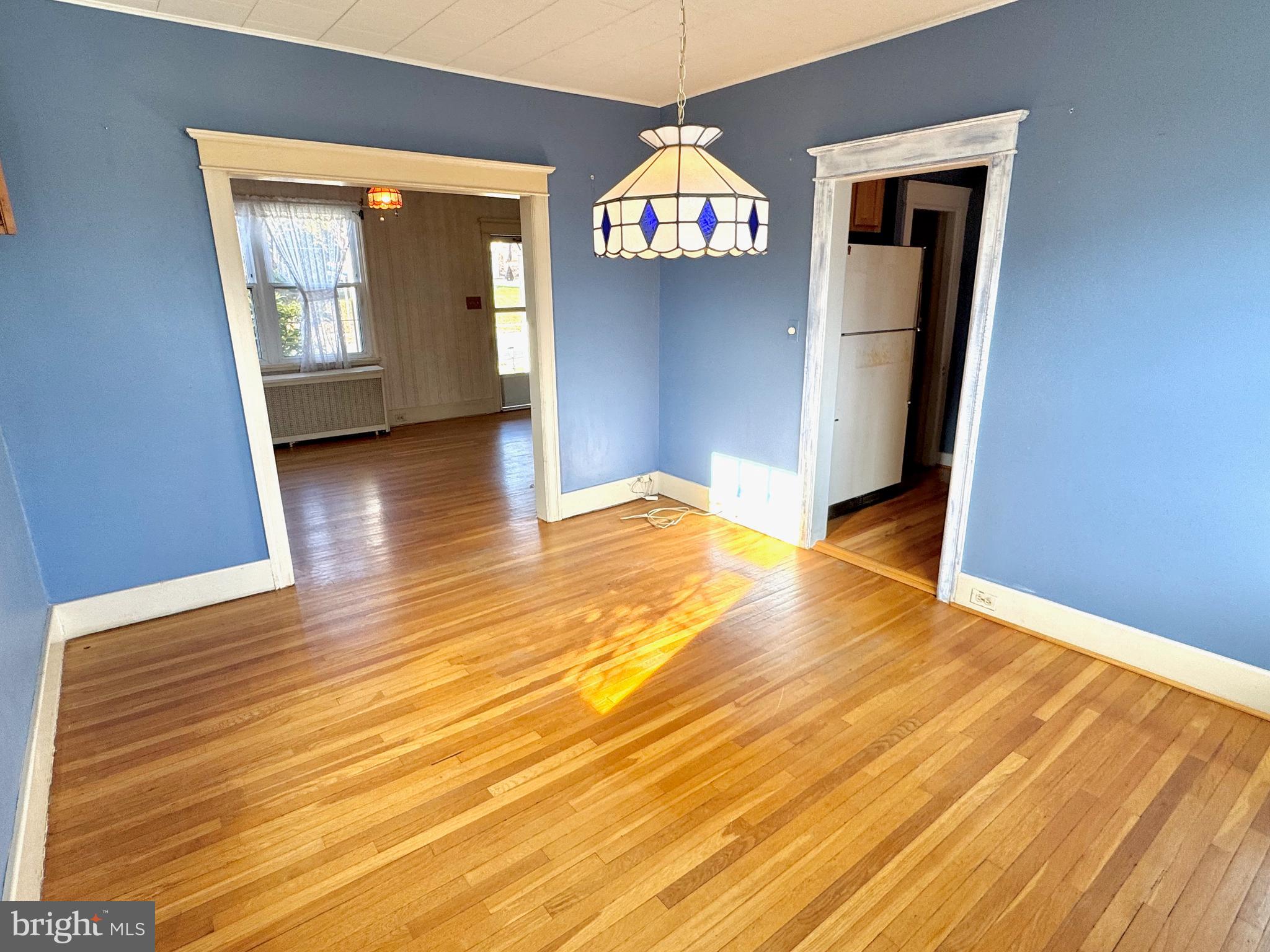 331 Sunset Road Reading, PA 19611 - Photo 6 of 32 a view of an empty room with wooden floor and a window